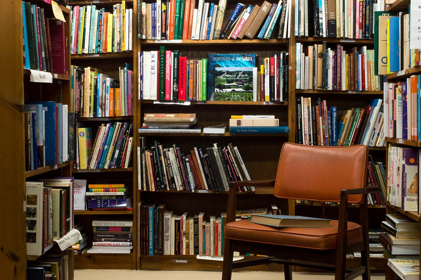 books on brown wooden shelf